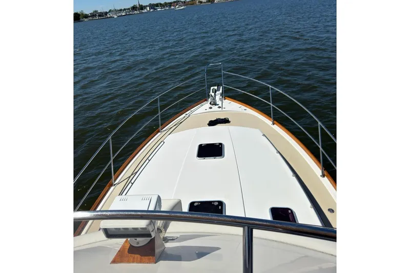 Slide: The Image of 2004 Sabre 42 Fly Bridge on calm waters. - 2