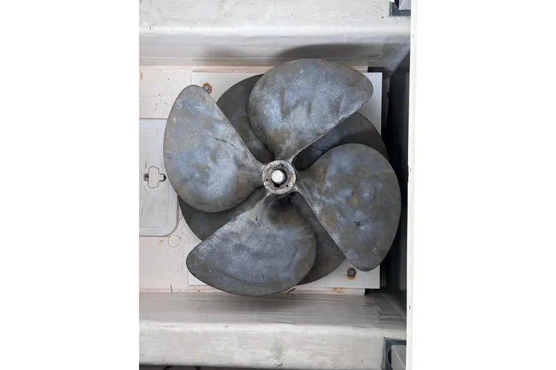 Slide: The Image of Propeller of 2004 Sabre 42 Fly Bridge boat, featuring four blades in a storage compartment. - 20