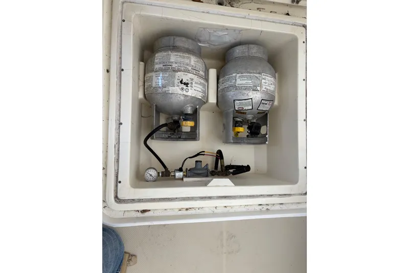 Slide: The Image of Propane tanks in storage compartment of 2004 Sabre 42 Fly Bridge boat. - 26