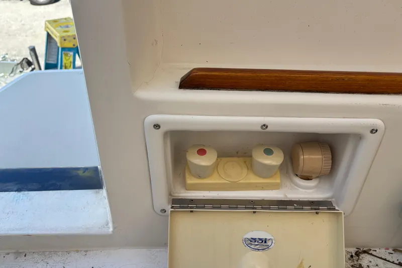 Slide: The Image of Control panel on a 2004 Sabre 42 Fly Bridge boat with knobs and dials. - 27