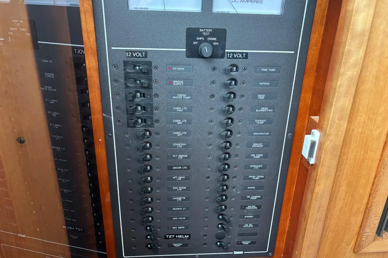 Slide: The Image of Electrical panel on a 2004 Sabre 42 Fly Bridge boat, featuring 12-volt switches. - 34