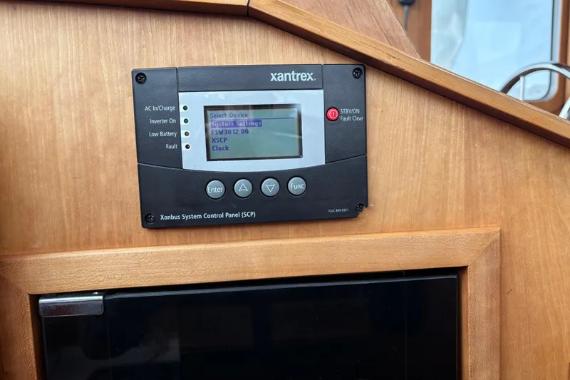 Slide: The Image of Xantrex control panel on 2004 Sabre 42 Fly Bridge, displaying system settings. - 35