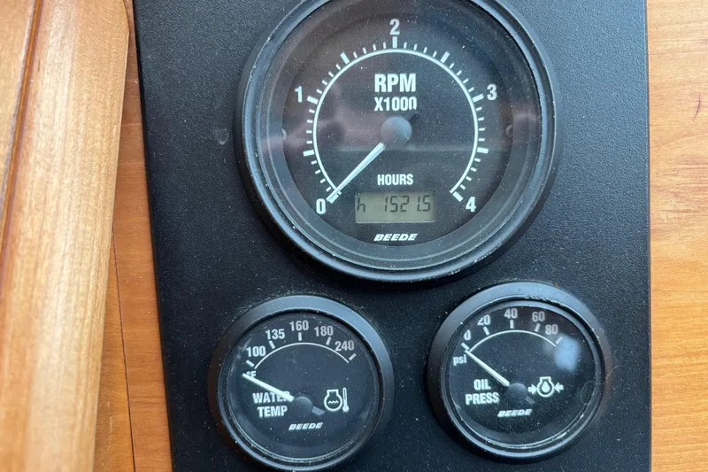 Slide: The Image of Instrument panel of a 2004 Sabre 42 Fly Bridge showing RPM, water temperature, and oil pressure gauges. - 36