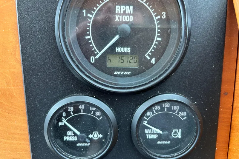 Slide: The Image of Gauges on 2004 Sabre 42 Fly Bridge showing RPM, oil pressure, and water temperature. - 37