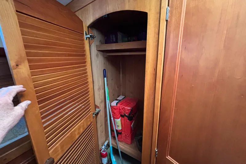 Slide: The Image of Wooden closet interior on a 2004 Sabre 42 Fly Bridge boat. - 40