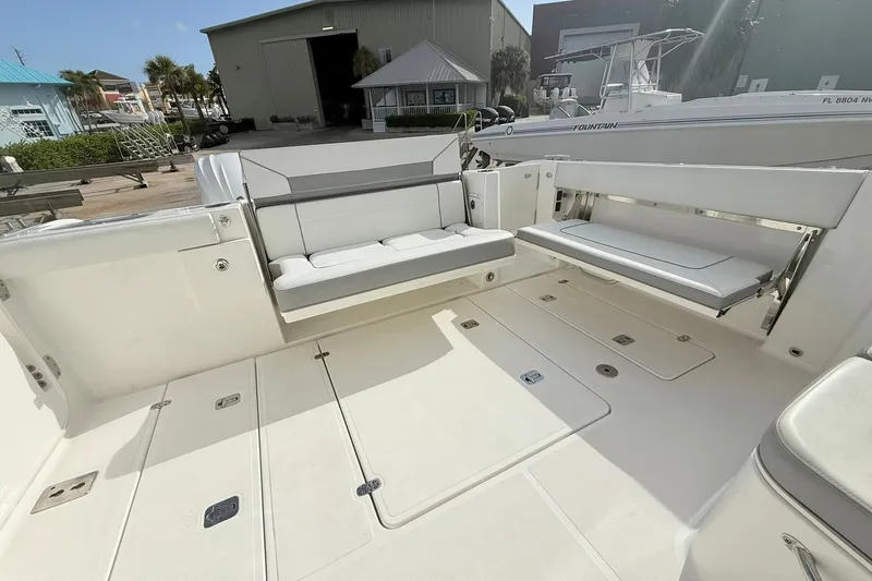Slide: The Image of 2022 Pursuit DC 365 Dual Console boat with spacious seating and sleek design. - 11