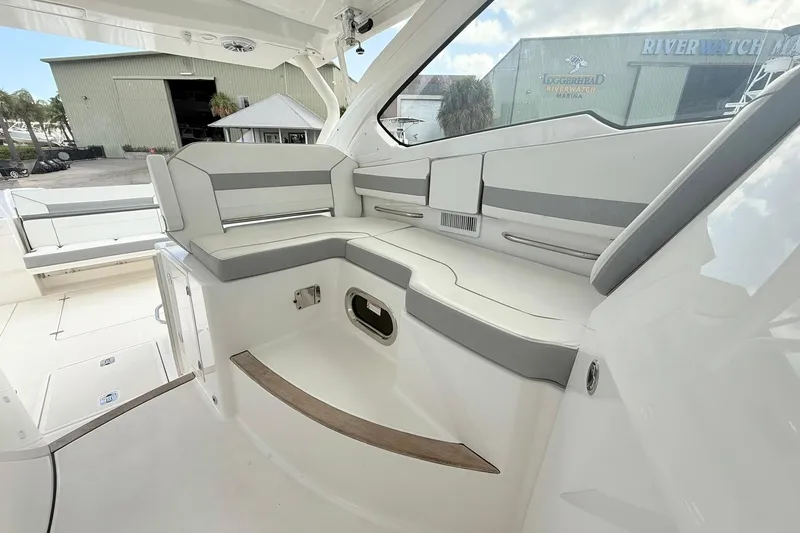 Slide: The Image of 2022 Pursuit DC 365 Dual Console boat interior with sleek seating and modern design. - 12