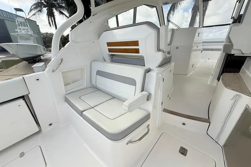Slide: The Image of 2022 Pursuit DC 365 Dual Console interior with white seating and modern design. - 8