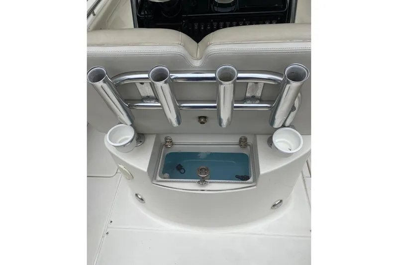 Slide: The Image of 2013 Blackwood 27 boat interior with rod holders and livewell. - 8