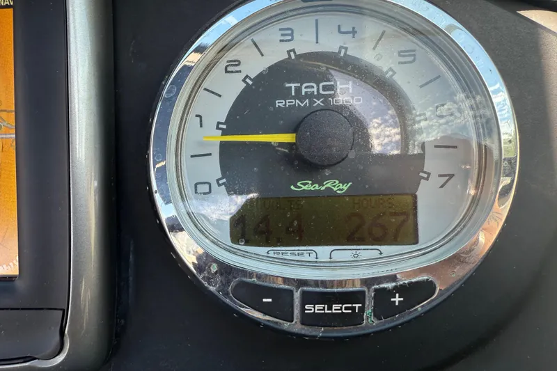 Slide: The Image of Tachometer of 2014 Sea Ray 220 Sundeck showing RPM and engine hours. - 15