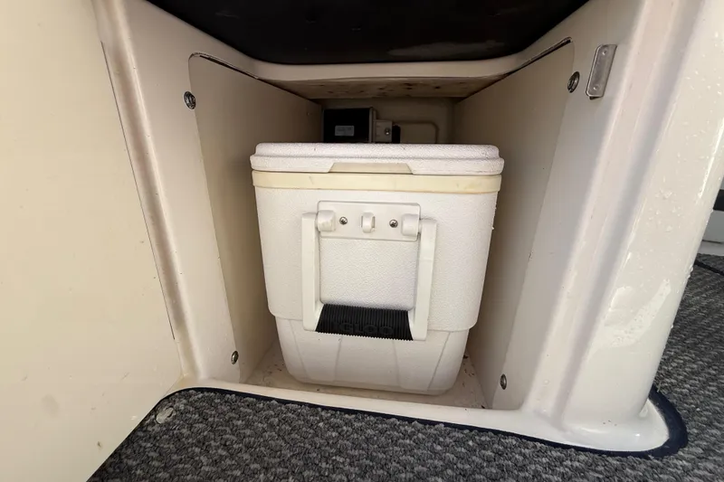Slide: The Image of Storage compartment with cooler on 2014 Sea Ray 220 Sundeck boat. - 17