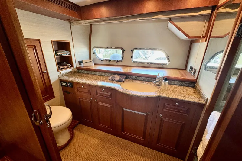 Slide: The Image of Luxurious bathroom interior of 2012 Grand Banks 53 Aleutian RP yacht with wooden cabinetry. - 11