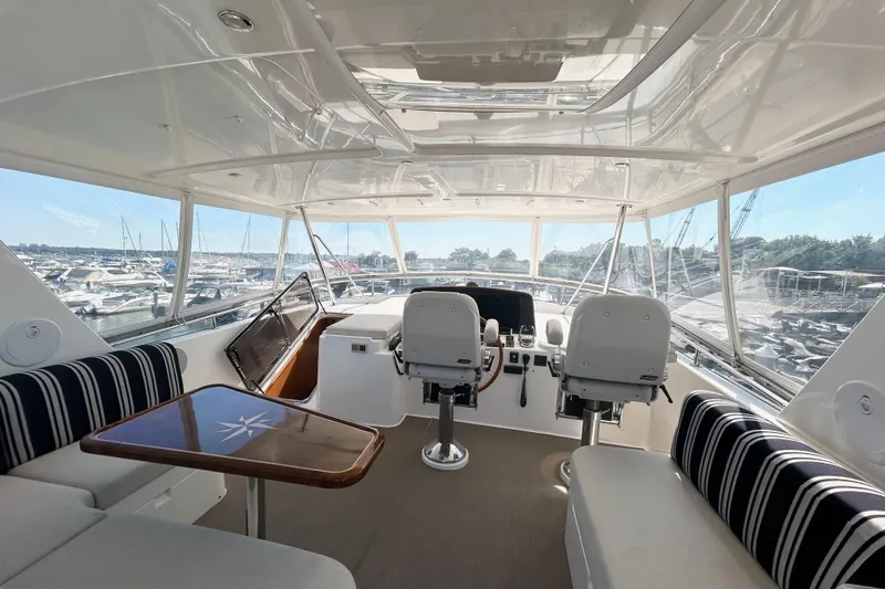 Slide: The Image of Luxurious interior of 2012 Grand Banks 53 Aleutian RP yacht with helm and seating area. - 18