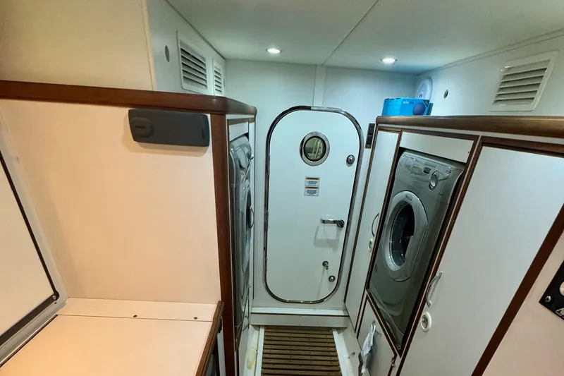 Slide: The Image of Laundry room aboard 2012 Grand Banks 53 Aleutian RP yacht with washer and dryer. - 22