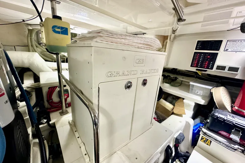 Slide: The Image of Engine room of 2012 Grand Banks 53 Aleutian RP yacht, featuring control panels and equipment. - 27