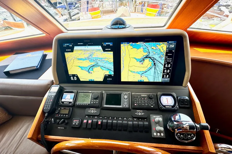 Slide: The Image of Helm of 2012 Grand Banks 53 Aleutian RP with navigation displays and controls. - 8