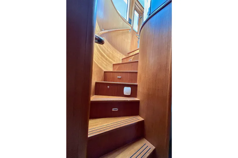 Slide: The Image of Wooden staircase inside 2012 Grand Banks 53 Aleutian RP yacht, leading to upper deck. - 9
