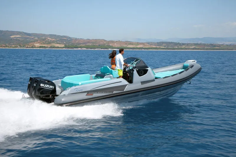 Slide: The Image of 2026 Ranieri CAYMAN 27.0 SPORT TOURING boat cruising on open water. - 3