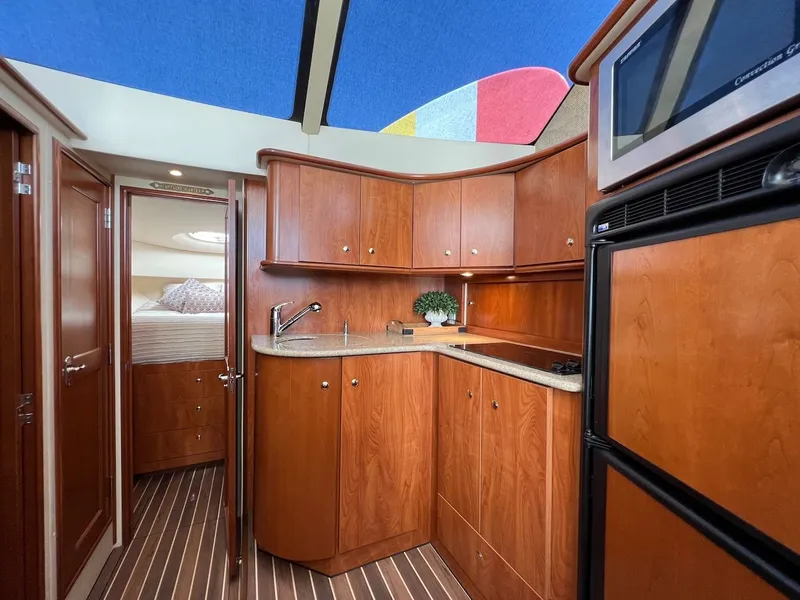 Slide: The Image of Interior of 2007 Silverton 36 Convertible with sofa and microwave. - 18