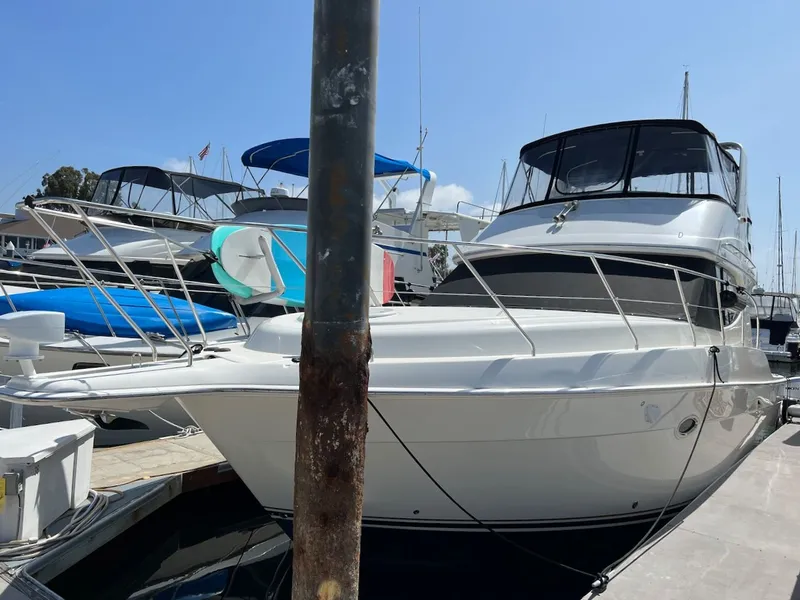 Slide: The Image of 2007 Silverton 36 Convertible Yacht docked at marina. - 2