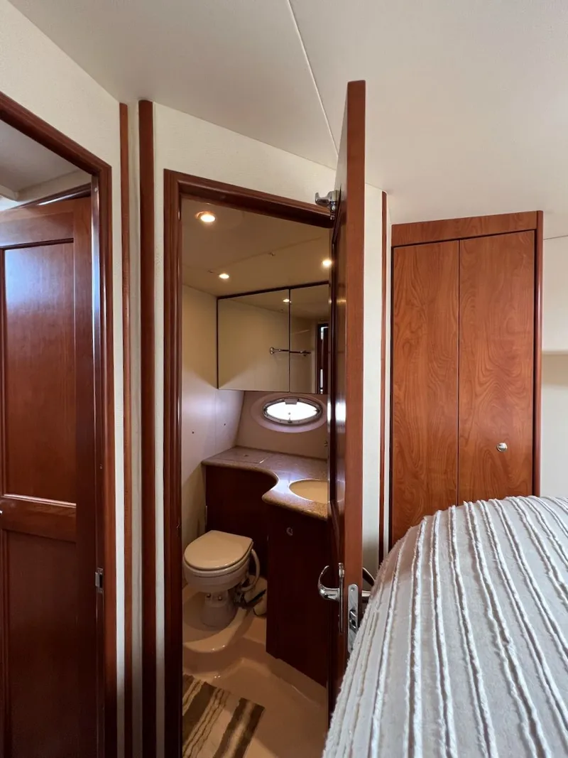 Slide: The Image of Interior of 2007 Silverton 36 Convertible yacht with wooden kitchen. - 27