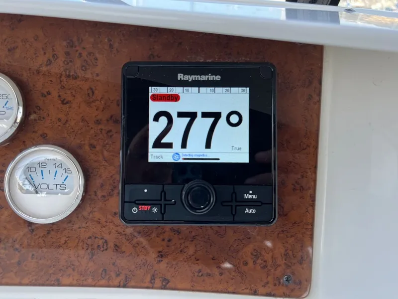 Slide: The Image of Interior view of 2007 Silverton 36 Convertible yacht with white seating area. - 41