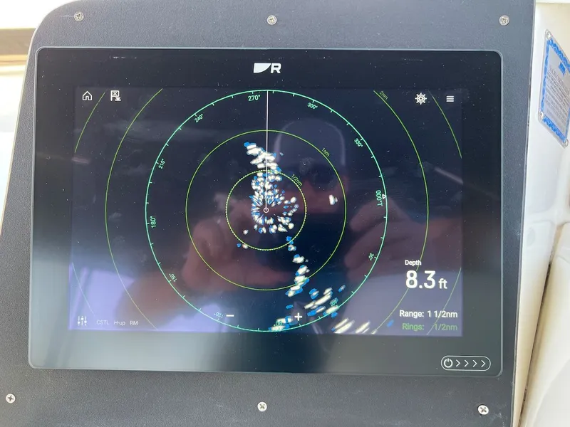 Slide: The Image of Interior of a 2007 Silverton 36 Convertible yacht with white upholstery. - 43