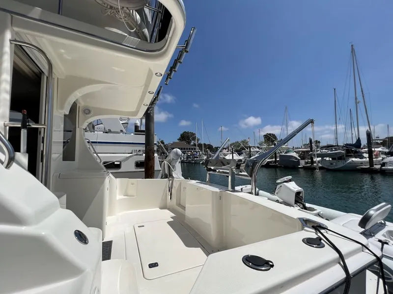 Slide: The Image of 2007 Silverton 36 Convertible Yacht docked with red fenders. - 5