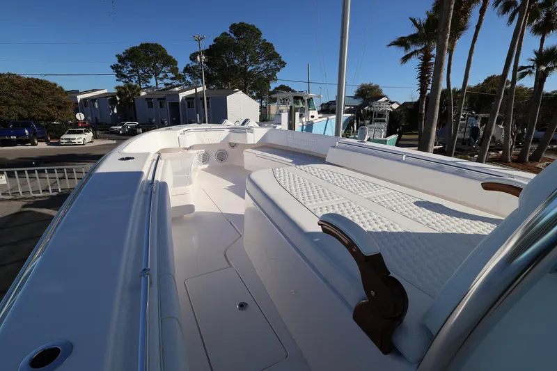 Slide: The Image of Helm of 2026 Contender 44 CB boat with navigation display and controls. - 11