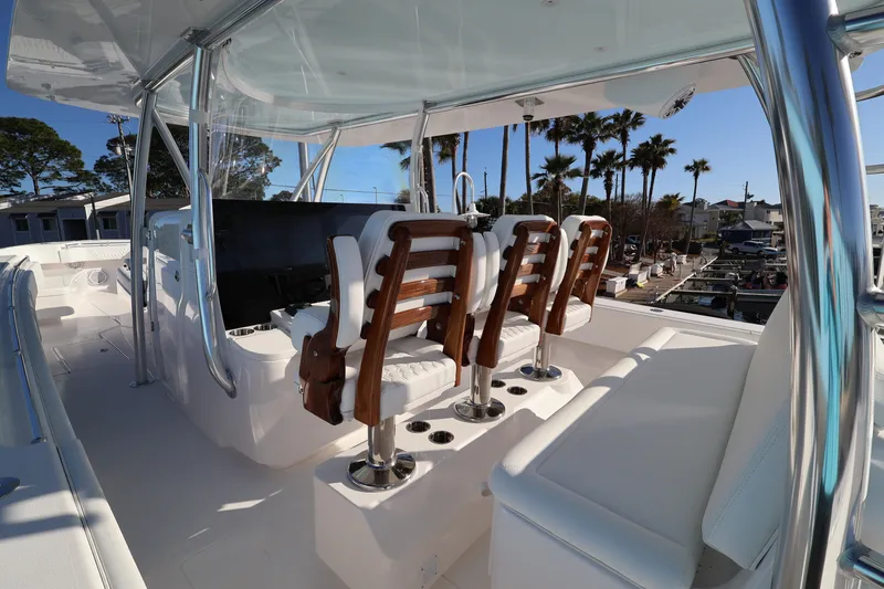 Slide: The Image of Helm of 2026 Contender 44 CB boat with steering wheel and navigation controls. - 13