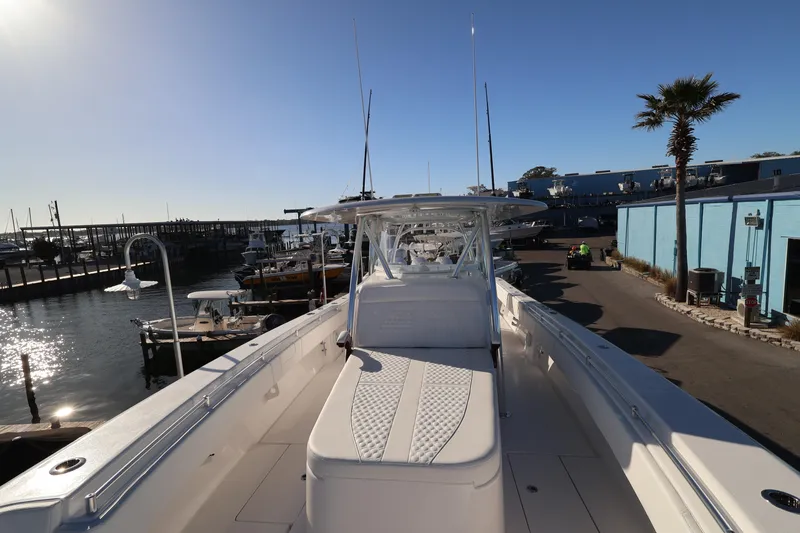 Slide: The Image of Control panel and vent on 2026 Contender 44 CB boat dashboard. - 16