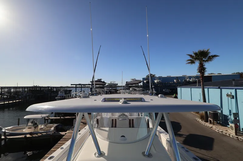 Slide: The Image of 2026 Contender 44 CB boat with spacious white deck and seating area. - 26