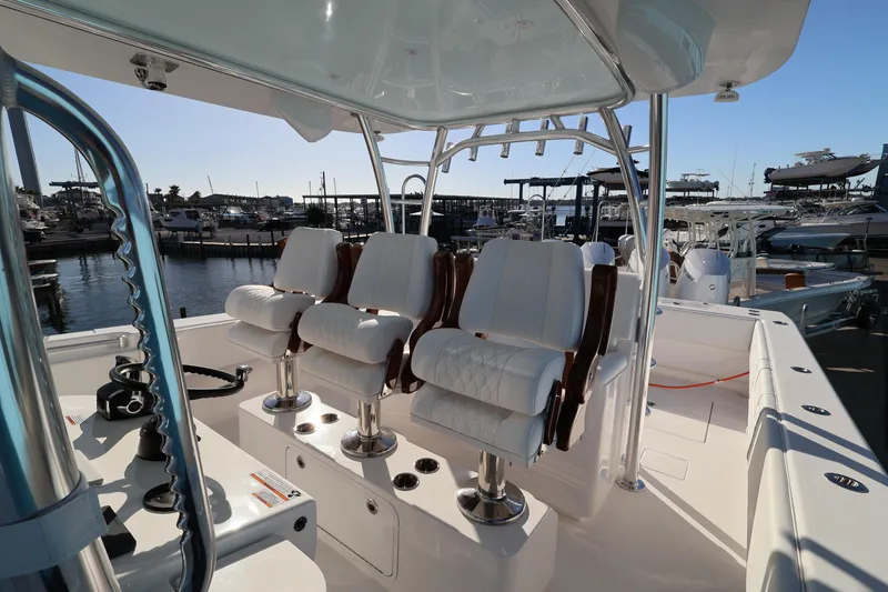 Slide: The Image of 2026 Contender 44 CB boat docked at marina under clear blue sky. - 29