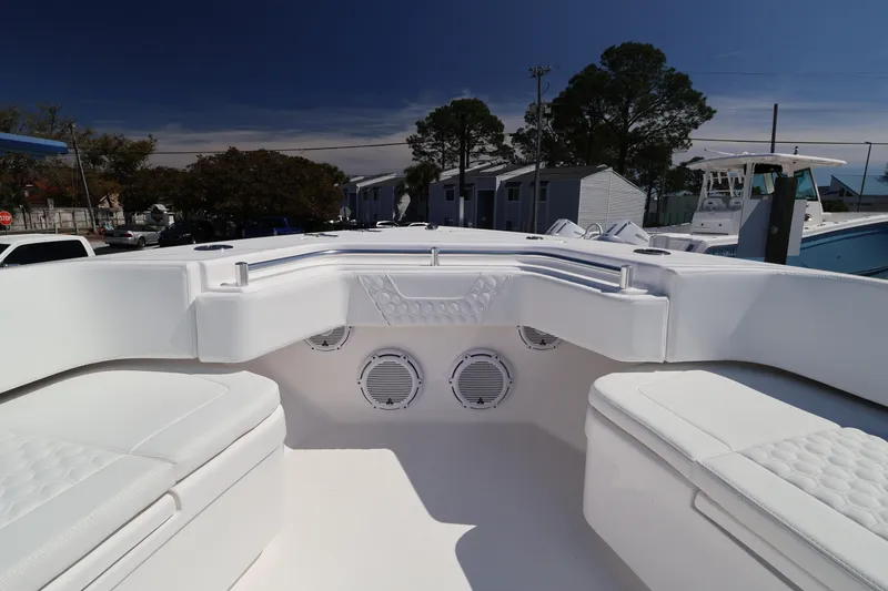 Slide: The Image of 2026 Contender 44 CB boat interior with white seating and speakers. - 34