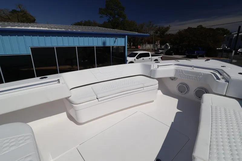 Slide: The Image of 2026 Contender 44 CB boat interior with white seating and modern design. - 36