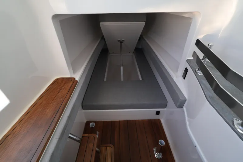 Slide: The Image of Manufacturer Provided Image: 2026 Contender 44 CB cabin interior with cozy bed and ambient lighting. - 58