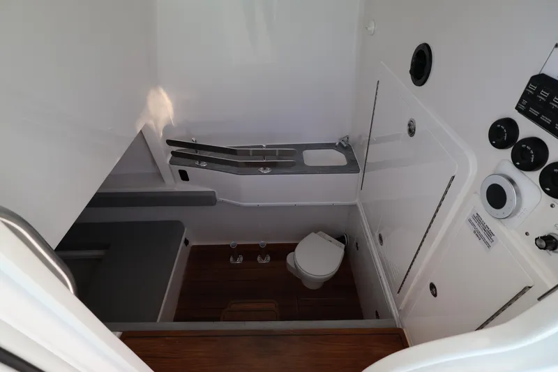 Slide: The Image of 2026 Contender 44 CB cabin interior with wooden flooring and cushioned seating. - 59