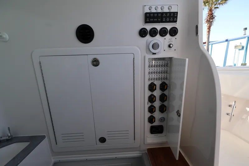 Slide: The Image of Interior of 2026 Contender 44 CB boat featuring a compact bathroom setup. - 61