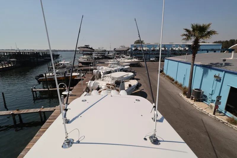 Slide: The Image of Trailer hitch of a 2026 Contender 44 CB boat at a marina. - 67
