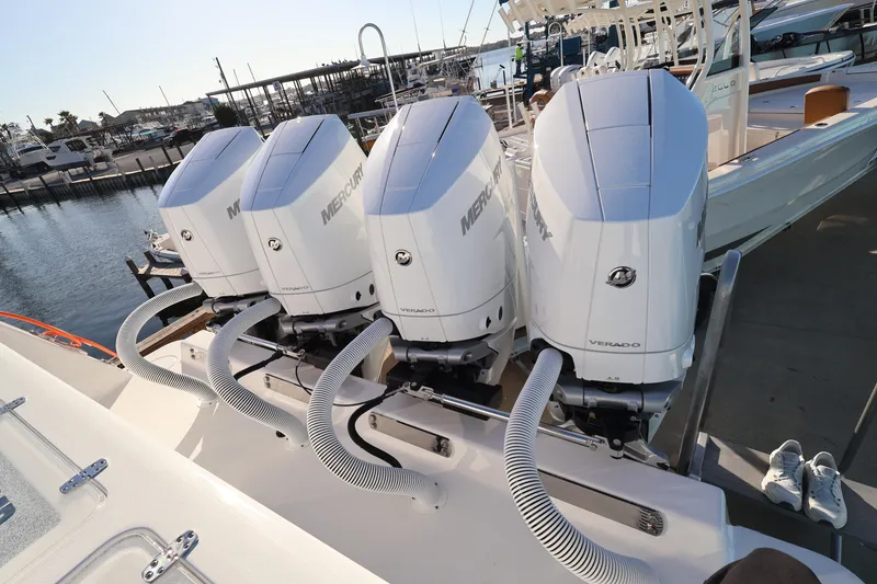 Slide: The Image of 2026 Contender 44 CB boat dashboard with navigation screens and controls. - 9