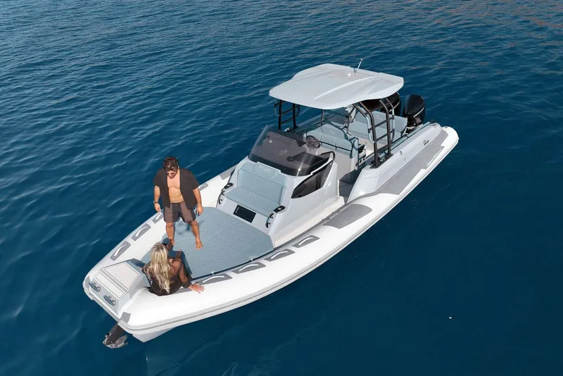 Slide: The Image of 2026 Ranieri CAYMAN 33.0 EXECUTIVE boat on open water with two people onboard. - 1