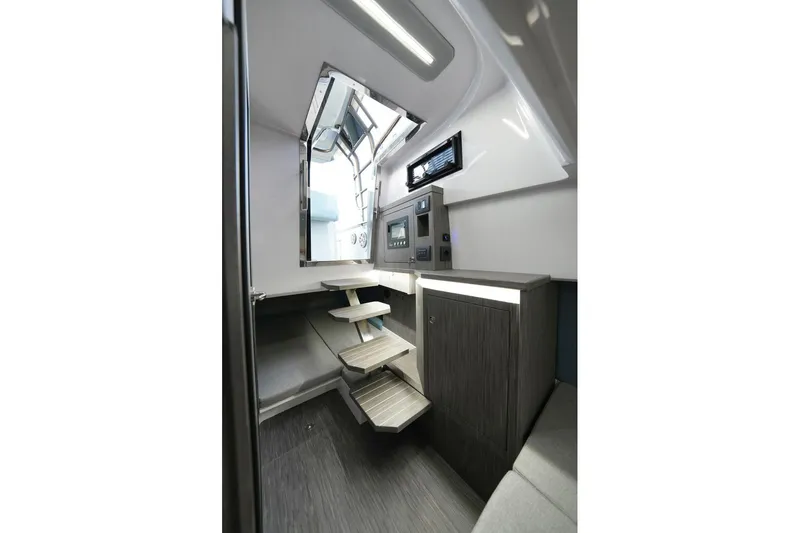 Slide: The Image of Interior of 2026 Ranieri CAYMAN 33.0 EXECUTIVE boat, featuring modern design and compact stairs. - 13
