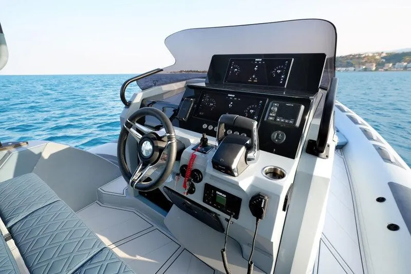 Slide: The Image of 2026 Ranieri CAYMAN 33.0 EXECUTIVE boat dashboard with modern controls and ocean view. - 14