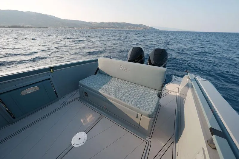 Slide: The Image of Luxury seating on 2026 Ranieri CAYMAN 33.0 EXECUTIVE boat, cruising on open sea. - 15