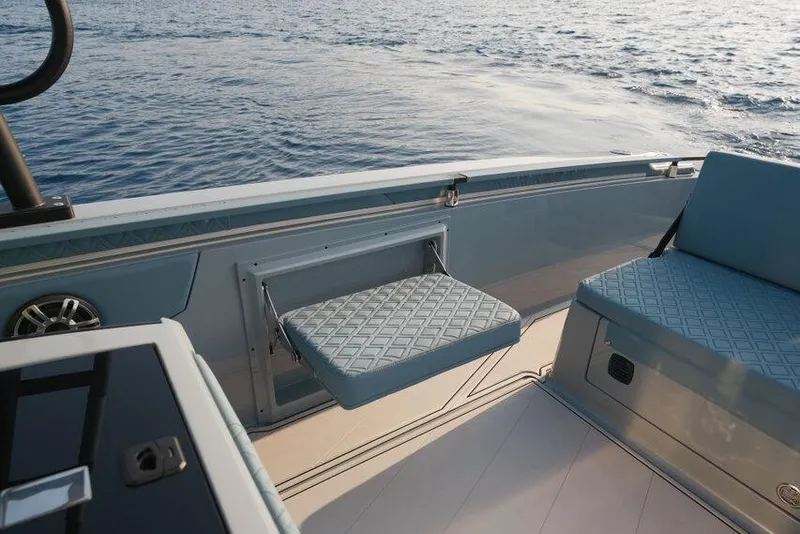 Slide: The Image of Luxury seating on 2026 Ranieri CAYMAN 33.0 EXECUTIVE boat, overlooking serene ocean waters. - 17