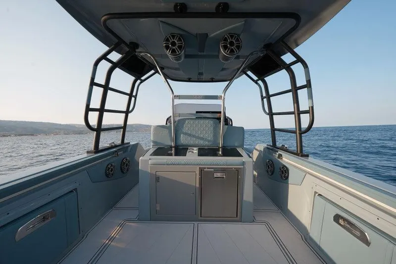 Slide: The Image of Interior view of 2026 Ranieri CAYMAN 33.0 EXECUTIVE boat on open water. - 21