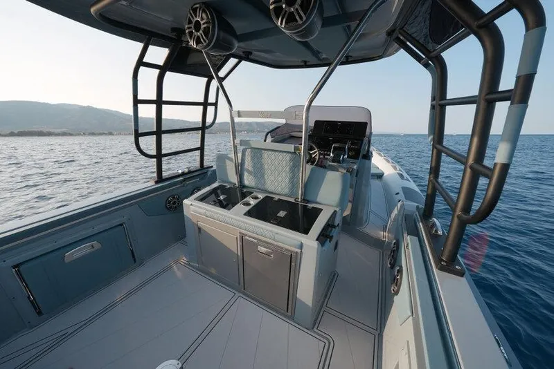 Slide: The Image of 2026 Ranieri CAYMAN 33.0 EXECUTIVE boat interior with sleek design on open water. - 23