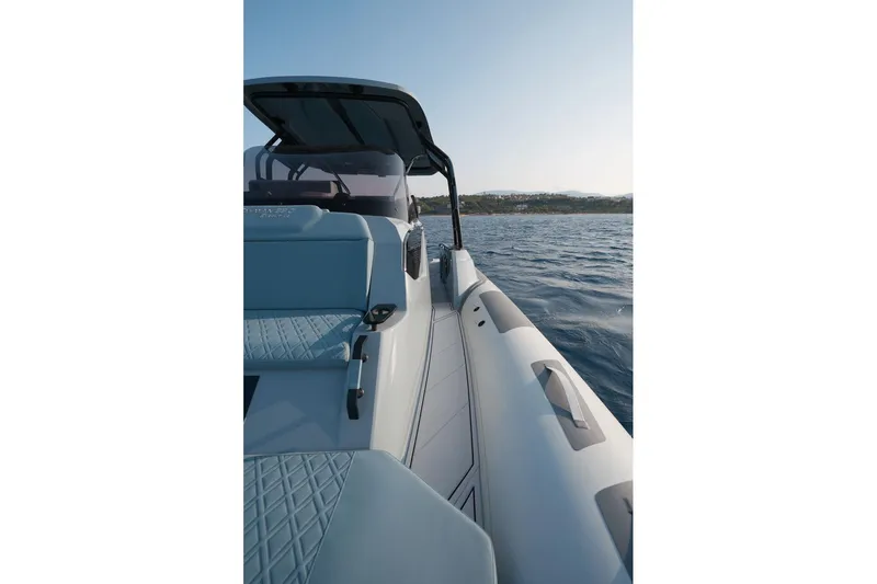 Slide: The Image of 2026 Ranieri CAYMAN 33.0 EXECUTIVE boat on open water, sleek design, sunny day. - 25