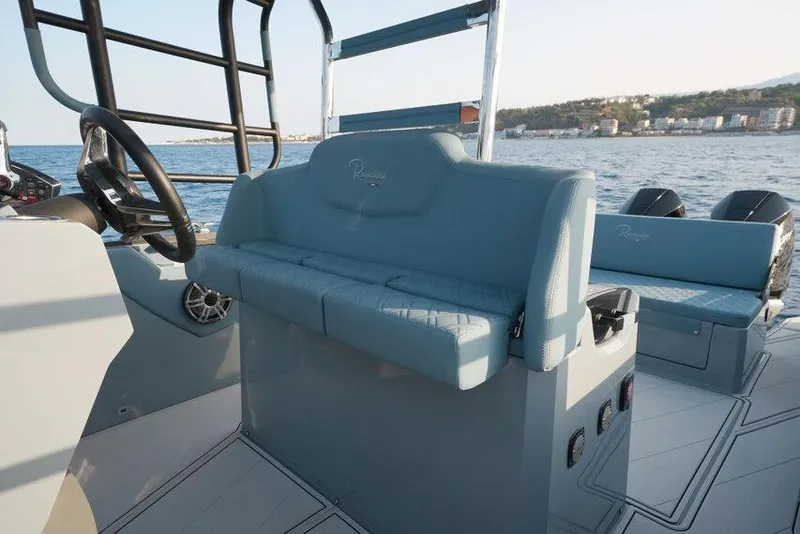 Slide: The Image of 2026 Ranieri CAYMAN 33.0 EXECUTIVE boat interior with blue seating and steering wheel. - 26