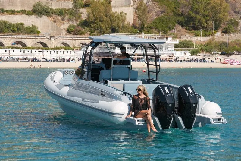 Slide: The Image of 2026 Ranieri CAYMAN 33.0 EXECUTIVE boat on clear water near scenic coastline. - 34